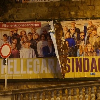 Il manifesto strappato nella zona di piazza Eroi Sanremesi